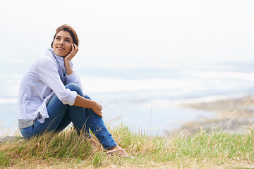 Image showing Old woman, thinking and landscape in nature with happiness, gratitude and peace on holiday or vacation. Retirement, mock up and person relax on hill at the beach, ocean or sea with ideas for future