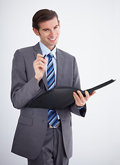 Image showing Portrait, documents and schedule with a business man in studio on a white background for planning or strategy. Smile, contract or file for paper with a happy young employee in a corporate suit