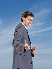 Image showing Business, portrait and man with hand pointing at you for support outdoor on blue sky background. We are hiring, recruitment or recruiter face smile with travel agency promotion or finger emoji choice