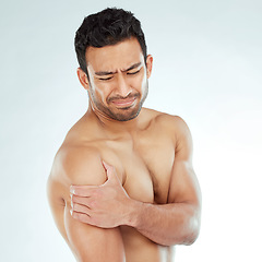 Image showing Shoulder pain, stress and fitness with man in studio for arthritis, tension or nerve problem on white background. Arm, injury and face of Asian model with osteoporosis, fibromyalgia or sport accident