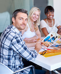 Image showing Portrait, man and creative team for brainstorming in office with picture, file and color for article planning. Diversity, male editor or writer with woman for meeting, discussion or collaboration