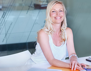 Image showing Portrait, happy business woman at desk or creative professional entrepreneur in office. Face smile, designer or employee at table, worker or young blonde person in Australia for startup career or job