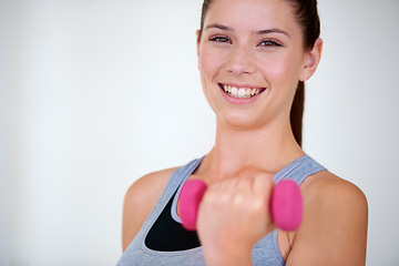 Image showing Woman, health and portrait with dumbbells in studio for training wellness, fitness and weight loss with exercise. Young person, happy and face with hand weights for tone muscle by white background