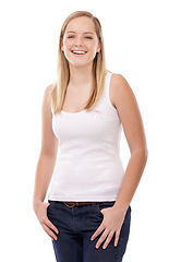 Image showing Happy portrait, breast cancer ribbon and woman smile for studio recovery, awareness campaign or support. Survivor empowerment, health sign or pride in disease recognition movement on white background