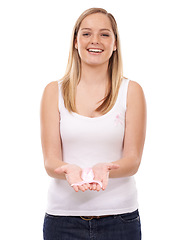 Image showing Happy woman, portrait and ribbon for breast cancer, support or awareness against a white studio background. Blonde female person smile with pink bow or band to start campaign for launch in healthcare