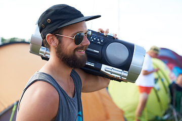 Image showing Radio, outdoor or happy man in music festival for party, event or concert with energy or listening. Rave, retro or person with smile, wellness or audio technology for techno, freedom or celebration