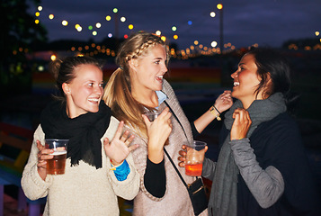 Image showing Friends, beer outdoor at night or music festival in forest adventure, nature celebration or group connection. Woman, face and smile for alcohol drinking or cheers toast for summer, travel or vacation