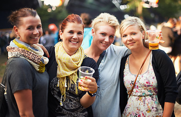 Image showing Portrait of group of women at music festival with beer, smile and hug in nature together. Drink, celebration and friends relax at outdoor party with freedom, adventure and happy people at concert.