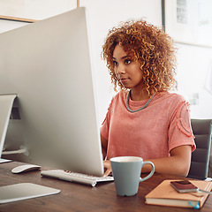 Image showing Businesswoman, typing or designer with computer for research, editing or copywriting on blog or web. Startup, agency or African woman in office working on internet update, networking or reading news