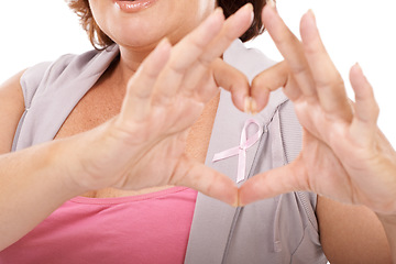 Image showing Woman, ribbon and heart hands for breast cancer awareness, love or care against a white studio background. Closeup of female person with like emoji, symbol or gesture in support or community campaign