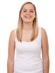 Image showing Studio portrait, breast cancer ribbon and happy woman with survivor wellness, awareness campaign or support. Happiness, health sign and girl smile for disease recognition movement on white background