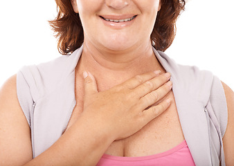 Image showing Woman, care and hand on chest in support with empathy, kindness and wellness in white background. Studio, closeup and person gesture to heart, healthcare and smile for blood pressure and pulse
