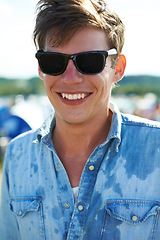 Image showing Smile, portrait or happy man at outdoor music festival for concert, party or event in nature. Face, sunglasses or male person enjoying sound outside in sunshine at carnival in summer for celebration