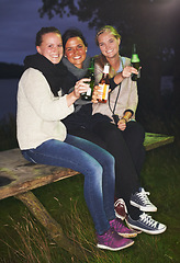 Image showing Friends, portrait and beer outdoor at night for camping adventure, nature celebration or group connection. Woman, face and smile for alcohol drinking or cheers toast for summer, travel or vacation