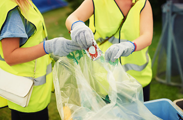 Image showing Waste, cleaner and people outdoor with a trash bag to recycle, garbage or beer can at festival. Volunteer, cleaning or hands of janitor with plastic, litter or working at event with junk or rubbish