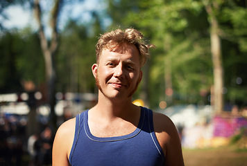 Image showing Portrait of man at music festival with smile, nature and relax in forest for concert event. Happiness, celebration at outdoor party with freedom and adventure, face of person with trees and sunshine.