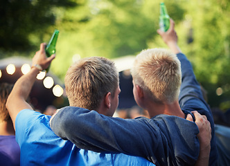 Image showing Back, toast and friends drinking beer at a music festival outdoor for a party, event or celebration. Summer, freedom and community with people enjoying alcohol at a concert, show or performance