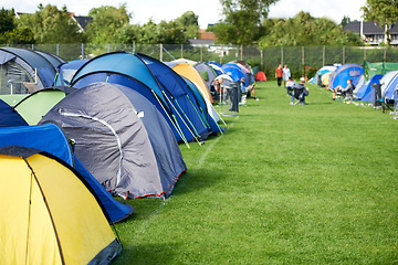 Image showing Camping, tents and outdoor music festival in park with people on field with grass or trees in summer. Camp, site and shelter at party, event or travel in woods for concert, adventure and carnival