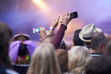 Image showing People, festival and crowd in music concert, cellphones and audience for event, entertainment and back. Technology, fun and gathering for rock and roll, celebration and performance for live streaming