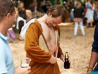 Image showing Animal, costume and man with beer at festival in field with friends and drunk in summer on holiday. Person, drink and relax on vacation at concert or carnival with funny monkey suit and freedom
