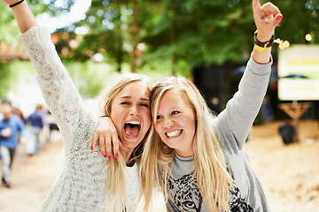 Image showing Excited, outdoor festival and friends hug, celebrate or happiness for fun bonding, rave party or social gathering. Music concert, wellness and girl cheers, energy and scream for entertainment event