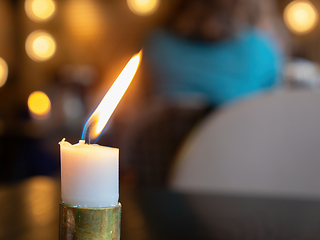 Image showing White candle burning