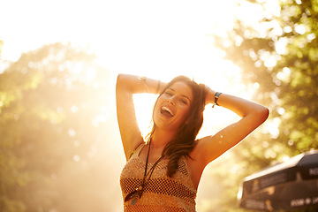 Image showing Portrait, smile and dance with a woman at a music festival outdoor for freedom, energy or excitement. Concert, flare and forest with a happy young person at an event or party for celebration