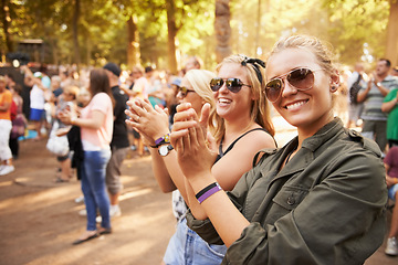 Image showing Woman, friends and outdoor crowd at music festival for summer holiday, celebration or party concert. Female person, clapping and community dancing in nature excited group, event or social gathering