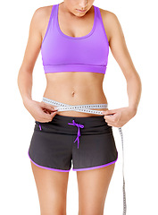 Image showing Woman, measuring tape or stomach for weight loss in studio with fitness, wellness or body progress. Person, belly or waist with target for exercise, training or workout on white background and face
