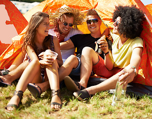 Image showing Friends, music festival and tent at camp drinking for fun celebration, party event for holiday connection. People, concert and rave community or social vacation weekend or outdoor, laughing with beer