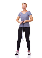 Image showing Portrait, woman and tape measure for fitness with weight loss progress, happy and exercise results in studio. Person, usa and smile face with health body, gym clothes and wellness by white background