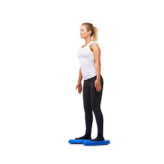 Image showing Balance, health and young with woman on disk in studio for workout, mindfulness or exercise. Wellness, challenge and training with person on white background for flexibility, smile or aerobics