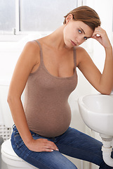 Image showing Nausea, pregnant woman and morning sickness in portrait, bathroom and uncomfortable person. Exhausted, moody and frustrated with illness, pregnancy and struggling with migraine pain on basin