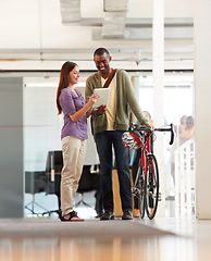 Image showing People, talking and tablet in office with bicycle for travel or morning commute to workplace. Bike messenger, logistics and discussion of business, project or checklist with employees and client