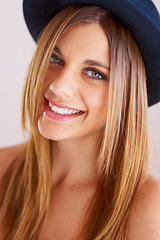 Image showing Hipster, hat and portrait of happy woman with vintage, fashion and confidence in white background or studio. Retro, style and face of person in old fashioned fedora with makeup, cosmetics and beauty