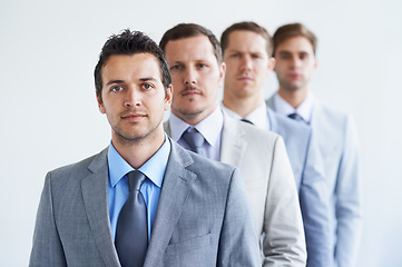 Image showing Men, portrait and serious for job interview, finance career and ready for selection process. Worker, corporate accountant in suit or professional in workplace, colleagues in background and confident