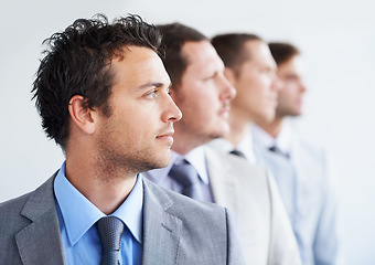 Image showing Men, thinking and serious for job interview, hiring selection and ready for finance career. Worker, corporate accountant in suit and professional in workplace, people in background and confident