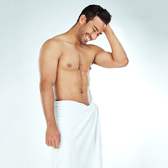 Image showing Cleaning, towel and happy fitness man in studio for wellness, hygiene or body care routine on white background. Shower, grooming or muscular Japanese male model with pamper, cosmetics or treatment