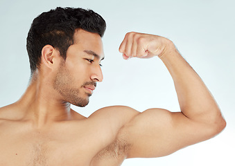 Image showing Fitness, asian man and bicep flex in studio for wellness, training or workout results on white background. Profile, exercise and Japanese male model with strong arm pose for strength or muscle growth