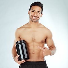 Image showing Face, body and fitness man hand pointing to protein in studio for workout recovery suggestion on white background. Product, whey or nutritionist show Weight loss, muscle growth or supplement support