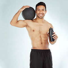 Image showing Fitness, water and portrait of happy man with medicine ball in studio for wellness, training and hydration on white background. Face, smile and male athlete with workout, results or body progress