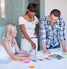 Image showing Creative, woman and team with discussion in boardroom for color, swatch and design for magazine layout. Diverse group, female leader and guidance for planning, brainstorming and sticky note for idea