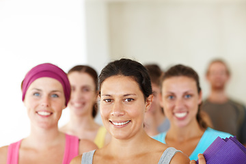 Image showing Portrait, yoga or training and woman with a group of people in a studio for health, wellness or mindfulness. Fitness, training and pilates with happy young friends in gym class for holistic exercise