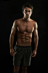 Image showing Topless, black background or portrait of man with six pack, strong abs or stomach in studio. Fitness model, cool or ripped male person with healthy body, dark shadow or abdomen muscle for wellness