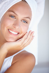 Image showing Face of happy woman, thinking or towel for skincare or wellness in bathroom for glow or detox. Morning, clean or confident lady with dermatology results, beauty or healthy skin with smile in home