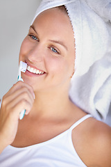 Image showing Woman, brushing teeth and smile for healthy in bathroom for hygiene mouth, gum dental care or wellness. Female person, toothbrush and whitening routine for orthodontics, oral glow or gingivitis shine