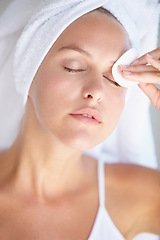 Image showing Skincare, woman or cotton pad to remove makeup or dirt with luxury skin product in home bathroom. Dermatology, model or female person cleaning in facial beauty spa treatment for cosmetics or wellness