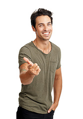 Image showing Smile, pointing and portrait of man in a studio for marketing, advertising or promotion with confidence. Happy, fashion and handsome young male model with a show hand gesture by white background.