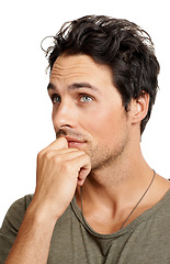 Image showing Thinking, planning and young man in a studio for choice, decision or options facial expression. Ideas, question and male person with brainstorming or dreaming face isolated by white background.
