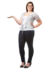 Image showing Portrait, presentation and palm with a plus size woman in studio isolated on a white background for offer. Advertising, marketing or information with a happy young person showing space recommendation